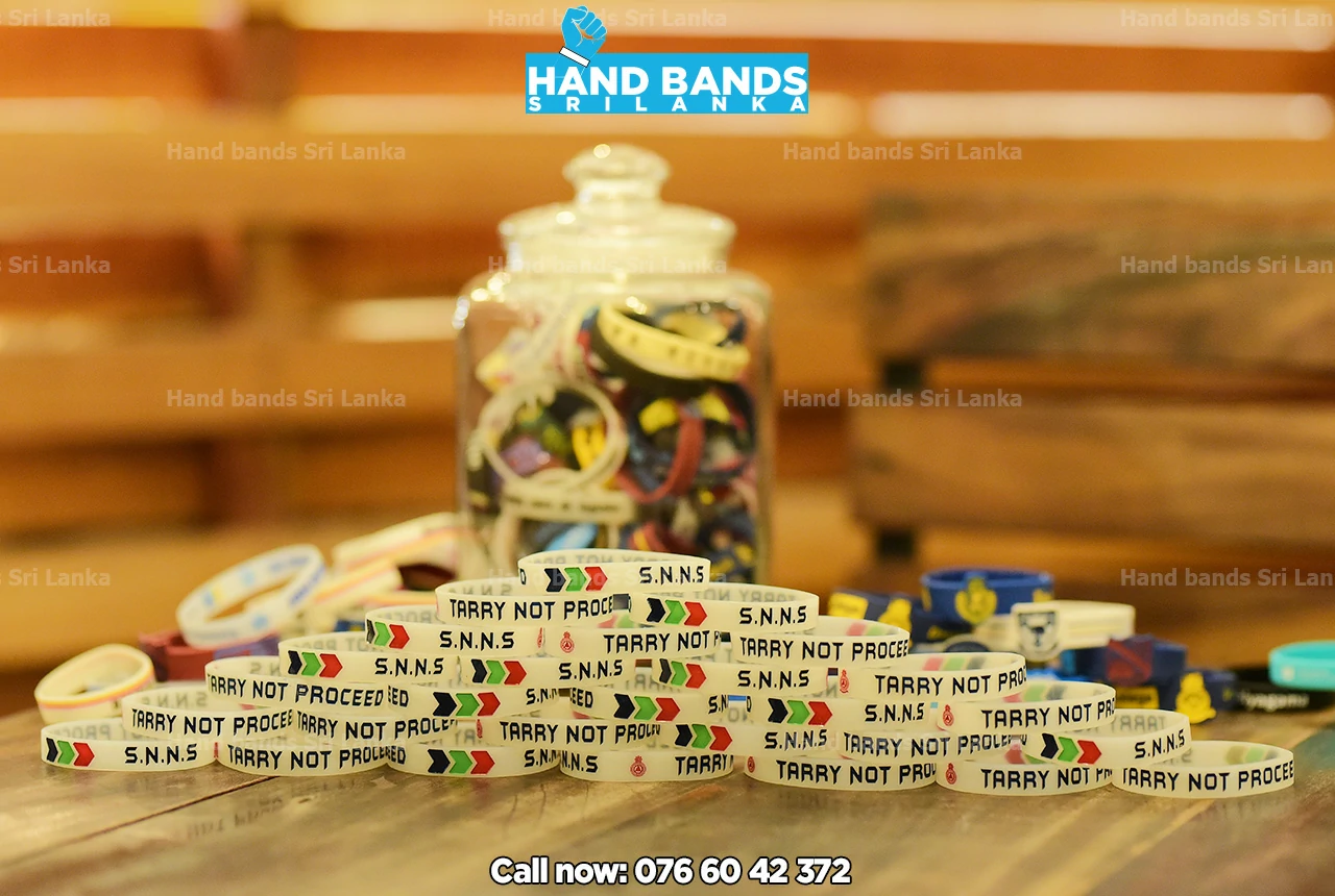 Debossed white silicone handband/wristbands, design for school bigmatch fundraising events in Sri Lanka