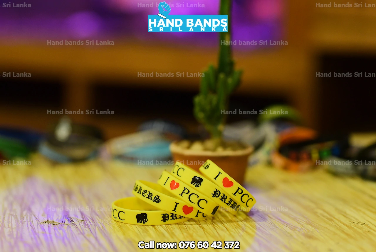 yellow Debossed silicone wristbands / handbands for school fundraising event in peradeniya central college, sri Lanka